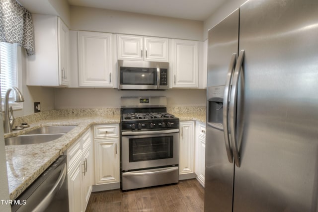 361 Belmont Dr Unit 14, Bristol, TN 37620 - kitchen with appliances with stainless steel finishes, white cabinetry, dark wood-style flooring, and light stone counters