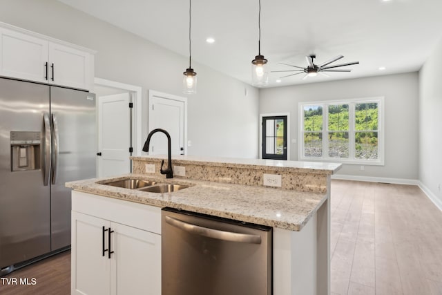 833 Granby Rd, Kingsport, TN 37660 - kitchen featuring stainless steel appliances, a sink, ceiling fan, an island with sink, and light stone countertops