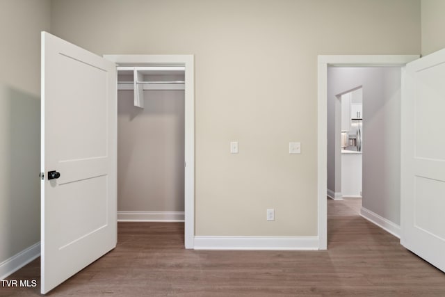 833 Granby Rd, Kingsport, TN 37660 - unfurnished bedroom with wood finished floors, baseboards, and a closet