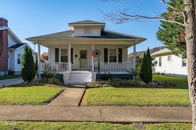 215 Clinchfield Ave, Erwin, TN 37650 - view of front of house featuring a front lawn, a shingled roof, and a porch