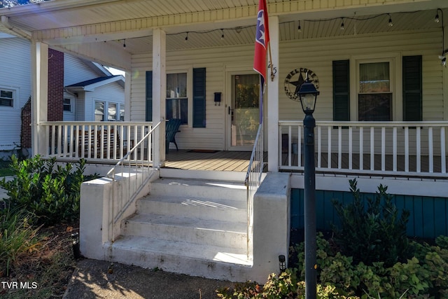 215 Clinchfield Ave, Erwin, TN 37650 - doorway to property featuring covered porch
