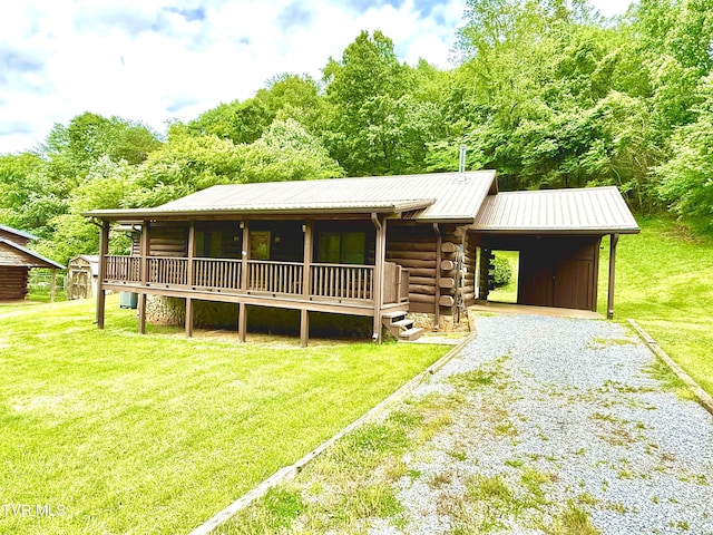 366 Judge Ben Allen Rd, Elizabethton, TN 37643 - cabin with driveway, a front lawn, metal roof, a carport, and log exterior