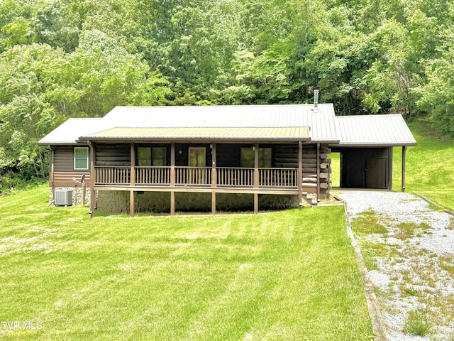 366 Judge Ben Allen Rd, Elizabethton, TN 37643 - view of front of home with driveway, central AC unit, log siding, and a front lawn