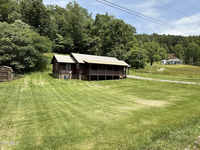 366 Judge Ben Allen Rd, Elizabethton, TN 37643 - view of green lawn featuring cooling unit and a wooded view