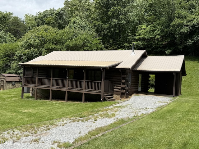 366 Judge Ben Allen Rd, Elizabethton, TN 37643 - log cabin with log exterior, gravel driveway, a front lawn, and metal roof