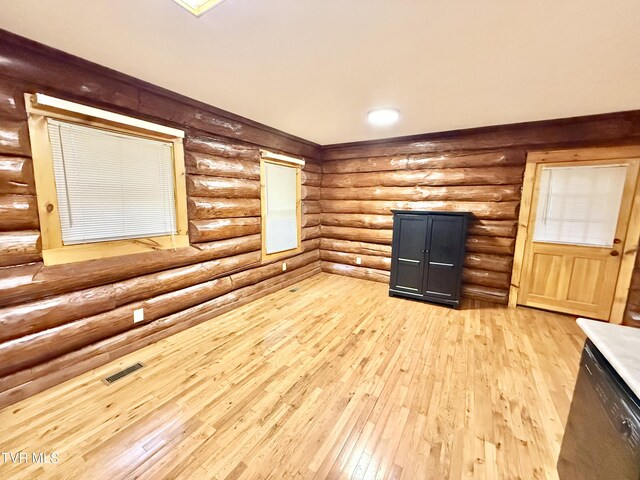 366 Judge Ben Allen Rd, Elizabethton, TN 37643 - unfurnished living room featuring light wood finished floors and log walls