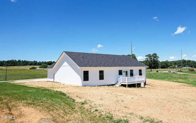5980 Snapps Ferry Rd, Afton, TN 37616 - rear view of house with a yard and roof with shingles