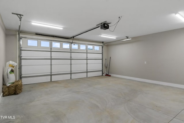 5980 Snapps Ferry Rd, Afton, TN 37616 - garage featuring a garage door opener and baseboards