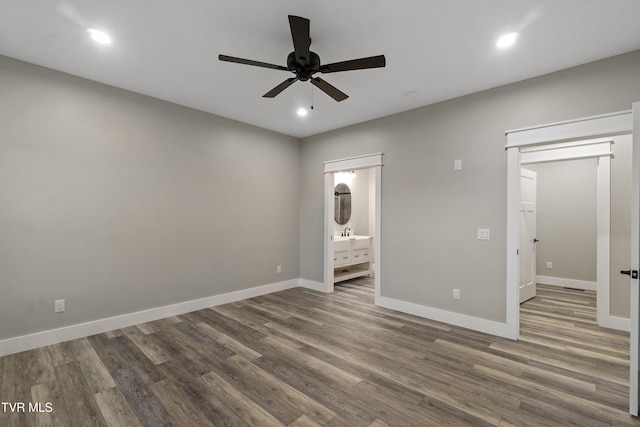 5980 Snapps Ferry Rd, Afton, TN 37616 - unfurnished bedroom with wood finished floors, baseboards, recessed lighting, ensuite bath, and ceiling fan