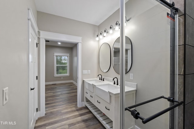 5980 Snapps Ferry Rd, Afton, TN 37616 - full bath with wood finished floors, double vanity, and baseboards