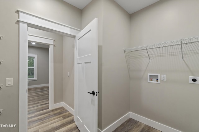 5980 Snapps Ferry Rd, Afton, TN 37616 - laundry room featuring hookup for an electric dryer, washer hookup, wood finished floors, and baseboards