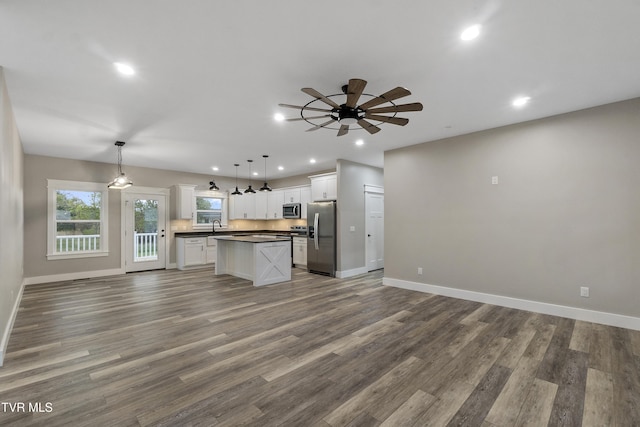 5980 Snapps Ferry Rd, Afton, TN 37616 - kitchen with stainless steel appliances, open floor plan, baseboards, dark countertops, and recessed lighting