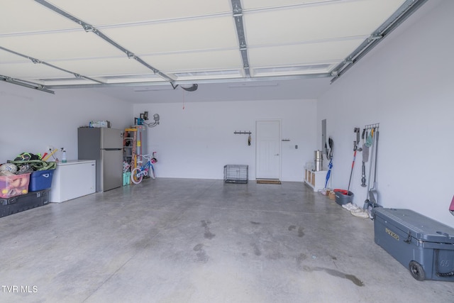 4073 Maize Pl, Piney Flats, TN 37686 - garage featuring freestanding refrigerator and water heater
