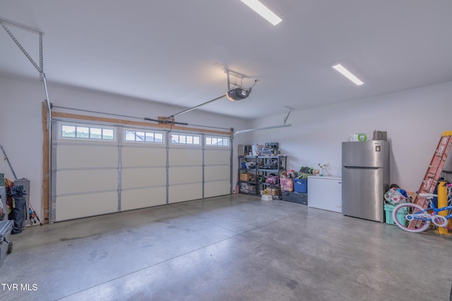 4073 Maize Pl, Piney Flats, TN 37686 - garage with freestanding refrigerator and a garage door opener