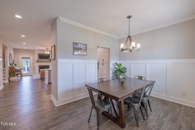 4073 Maize Pl, Piney Flats, TN 37686 - dining room featuring a decorative wall, a chandelier, dark wood-type flooring, a fireplace, and ornamental molding