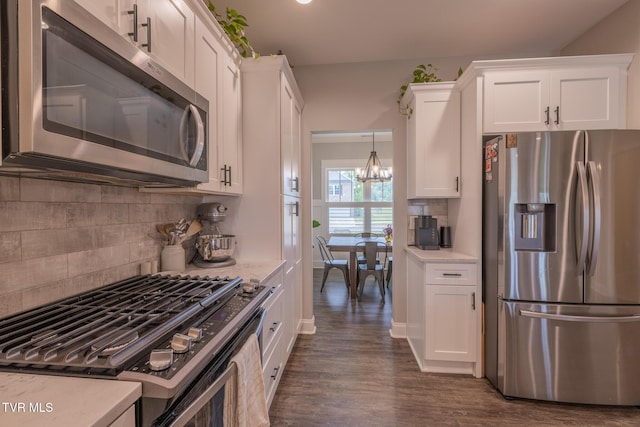 4073 Maize Pl, Piney Flats, TN 37686 - kitchen featuring stainless steel appliances, light countertops, white cabinetry, and dark wood finished floors