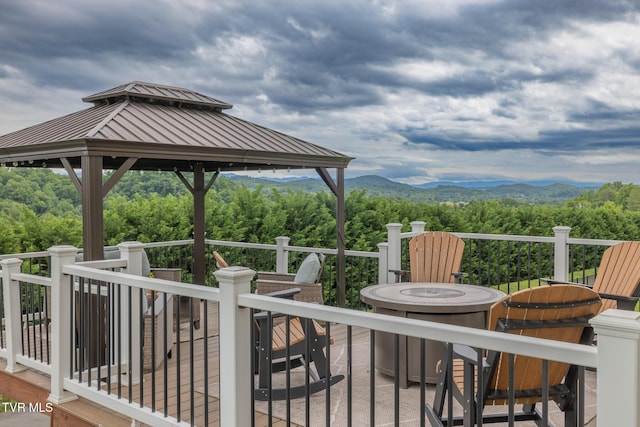 4073 Maize Pl, Piney Flats, TN 37686 - wooden deck featuring a fire pit, a mountain view, a gazebo, and a forest view