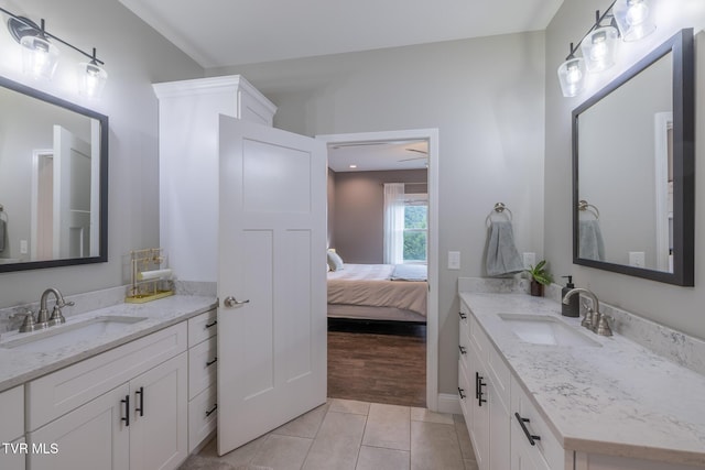 4073 Maize Pl, Piney Flats, TN 37686 - ensuite bathroom with two vanities, tile patterned flooring, and baseboards