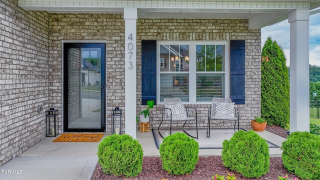 4073 Maize Pl, Piney Flats, TN 37686 - view of exterior entry with covered porch and brick siding