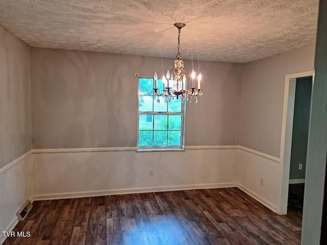 226 Heritage Hills Dr, Greeneville, TN 37745 - empty room featuring dark wood-style floors, a textured ceiling, a chandelier, and baseboards