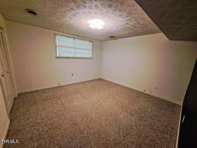 226 Heritage Hills Dr, Greeneville, TN 37745 - unfurnished bedroom with carpet, a textured ceiling, a closet, and baseboards