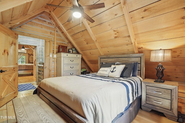 166 Booher Rd, Jonesborough, TN 37659 - bedroom with light wood finished floors, vaulted ceiling, wooden walls, and wooden ceiling