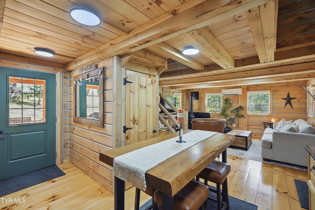 166 Booher Rd, Jonesborough, TN 37659 - dining space with wood ceiling with exposed beams, wooden walls, light wood finished floors, stairs, and a wall mounted AC