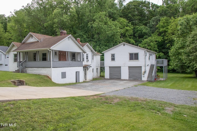 1416 E Cedar St, Bristol, TN 37620 - view of front of house with stairs, a chimney, concrete driveway, a porch, and a front lawn