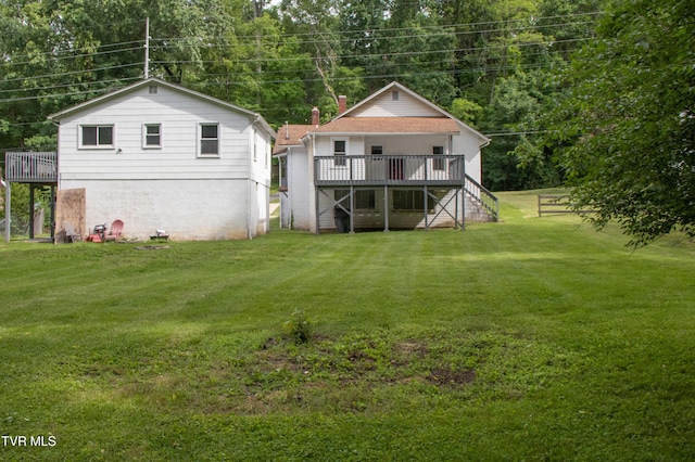 1416 E Cedar St, Bristol, TN 37620 - rear view of house with stairway, a wooden deck, and a lawn