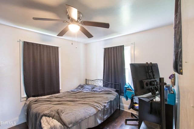 1416 E Cedar St, Bristol, TN 37620 - bedroom with dark wood finished floors, ceiling fan, and baseboards