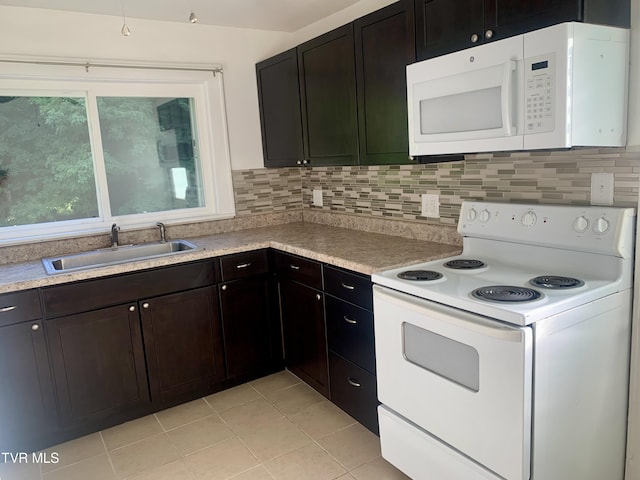 1416 E Cedar St, Bristol, TN 37620 - kitchen featuring white appliances, a sink, light tile patterned flooring, and light countertops