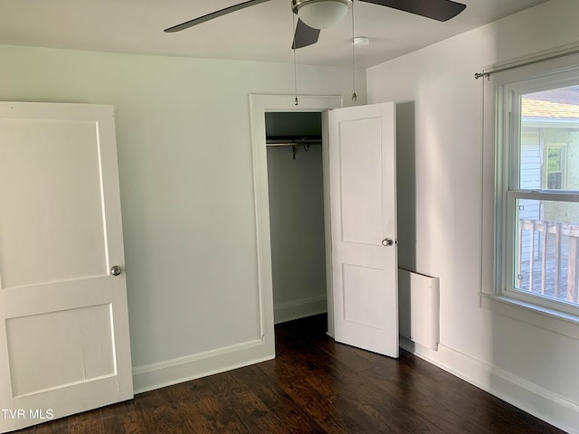 1416 E Cedar St, Bristol, TN 37620 - unfurnished bedroom with dark wood-style flooring, baseboards, ceiling fan, and a closet