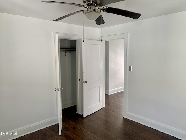 1416 E Cedar St, Bristol, TN 37620 - unfurnished bedroom featuring baseboards, dark wood-style flooring, a closet, and a ceiling fan