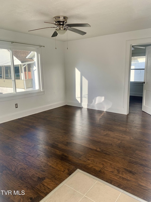 1416 E Cedar St, Bristol, TN 37620 - unfurnished room with hardwood / wood-style flooring, a ceiling fan, healthy amount of natural light, and baseboards