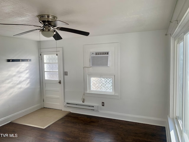 1416 E Cedar St, Bristol, TN 37620 - entrance foyer featuring baseboard heating, wood-type flooring, baseboards, ceiling fan, and an AC wall unit