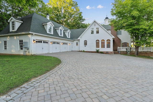 133 Knob Creek Dock Rd, Johnson City, TN 37601 - view of front of house featuring decorative driveway, a shingled roof, a front lawn, an attached garage, and a chimney