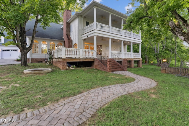 133 Knob Creek Dock Rd, Johnson City, TN 37601 - back of house featuring ceiling fan, stairs, a chimney, a yard, and a balcony