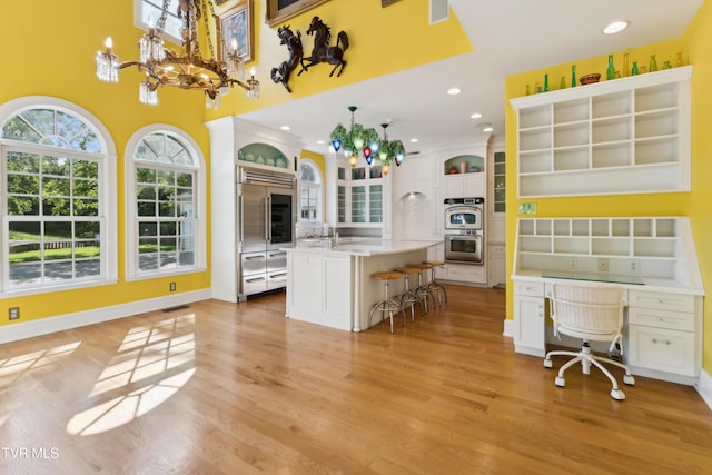 133 Knob Creek Dock Rd, Johnson City, TN 37601 - kitchen featuring appliances with stainless steel finishes, a kitchen bar, an office area, a sink, and light countertops
