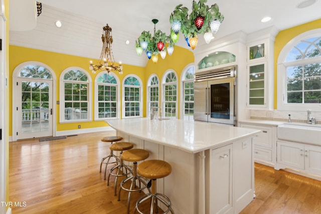 133 Knob Creek Dock Rd, Johnson City, TN 37601 - kitchen featuring built in fridge, a sink, a chandelier, a breakfast bar area, and light wood finished floors