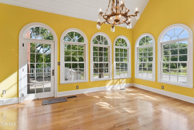 133 Knob Creek Dock Rd, Johnson City, TN 37601 - unfurnished sunroom with healthy amount of natural light, wood finished floors, a chandelier, vaulted ceiling, and baseboards