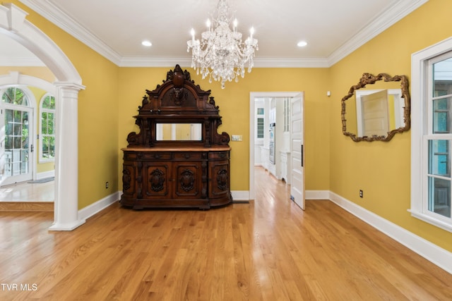 133 Knob Creek Dock Rd, Johnson City, TN 37601 - living area featuring plenty of natural light, ornate columns, arched walkways, crown molding, and light wood-style floors