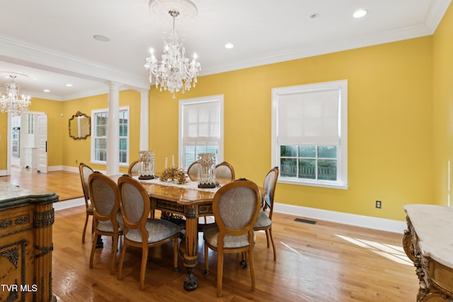 133 Knob Creek Dock Rd, Johnson City, TN 37601 - dining space with a chandelier, light wood-style flooring, baseboards, crown molding, and decorative columns