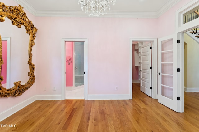 133 Knob Creek Dock Rd, Johnson City, TN 37601 - unfurnished bedroom featuring a chandelier, crown molding, light wood-type flooring, a spacious closet, and baseboards
