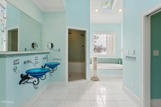 133 Knob Creek Dock Rd, Johnson City, TN 37601 - bathroom featuring a shower stall, a garden tub, tile patterned flooring, a skylight, and baseboards
