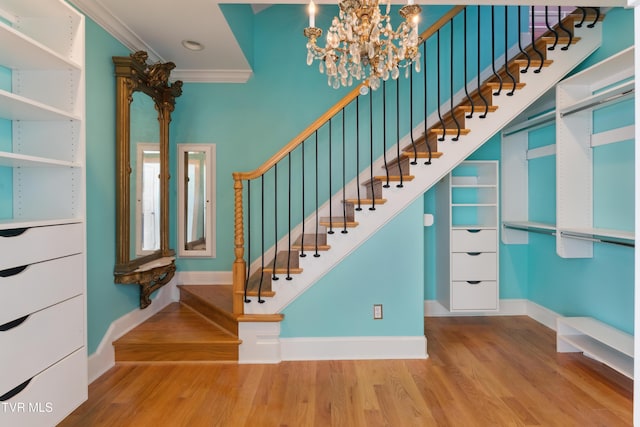 133 Knob Creek Dock Rd, Johnson City, TN 37601 - stairs featuring ornamental molding, wood finished floors, baseboards, and a chandelier