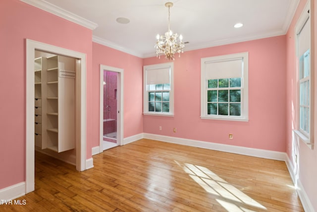 133 Knob Creek Dock Rd, Johnson City, TN 37601 - unfurnished bedroom featuring a chandelier, light wood-type flooring, a closet, a walk in closet, and baseboards