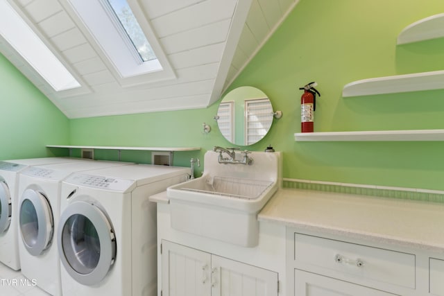 133 Knob Creek Dock Rd, Johnson City, TN 37601 - washroom featuring washer and dryer, a skylight, and cabinet space