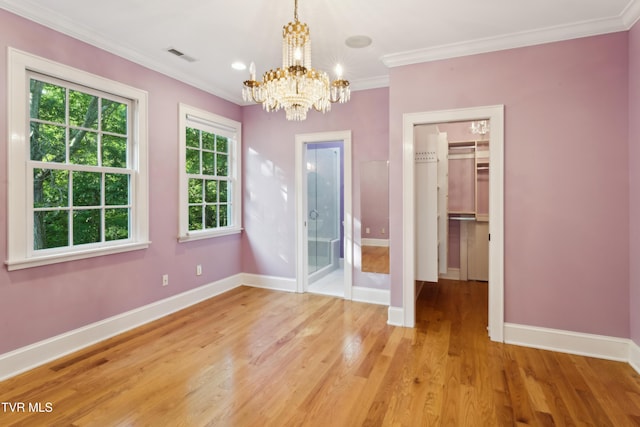 133 Knob Creek Dock Rd, Johnson City, TN 37601 - unfurnished dining area featuring a chandelier, baseboards, light wood-type flooring, and ornamental molding