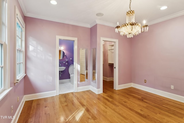 133 Knob Creek Dock Rd, Johnson City, TN 37601 - unfurnished room with a chandelier, light wood-type flooring, baseboards, plenty of natural light, and ornamental molding