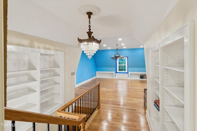 133 Knob Creek Dock Rd, Johnson City, TN 37601 - corridor with a chandelier, wood finished floors, lofted ceiling, and baseboards